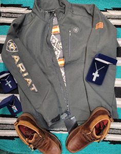 Ariat jacket with brown dress shoes and cross necklace