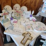 Crosses and heart decor with religious sayings pictured